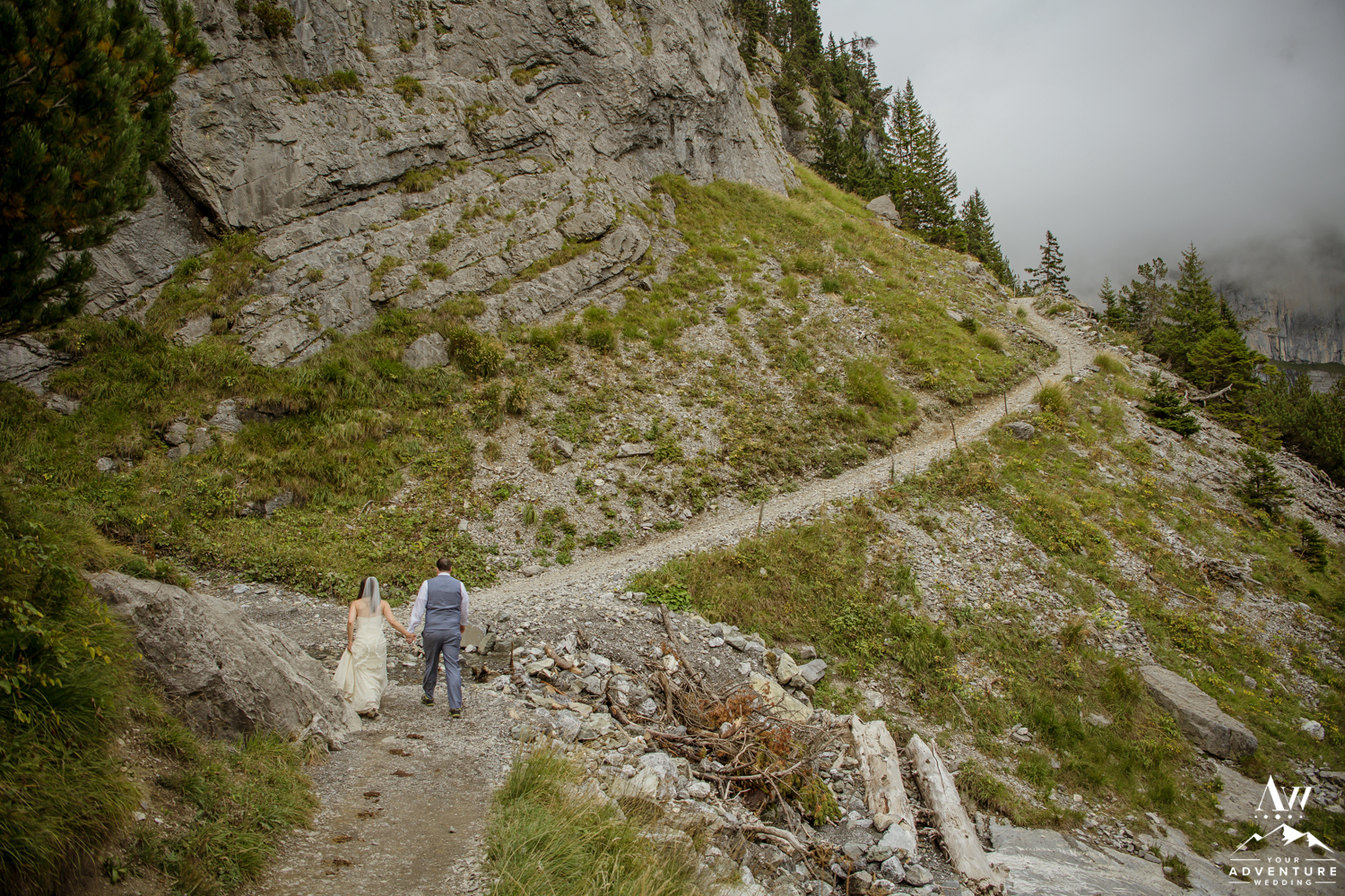 couple hiking during wedding day in Switzerland