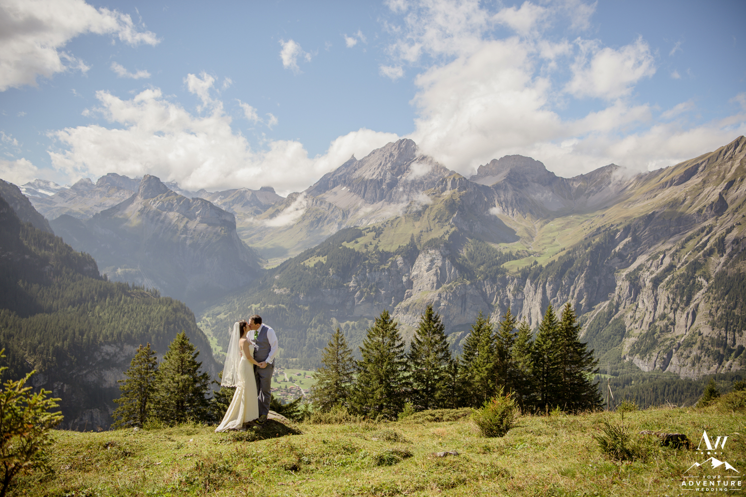 Couple kissing in front of the Swiss Alps