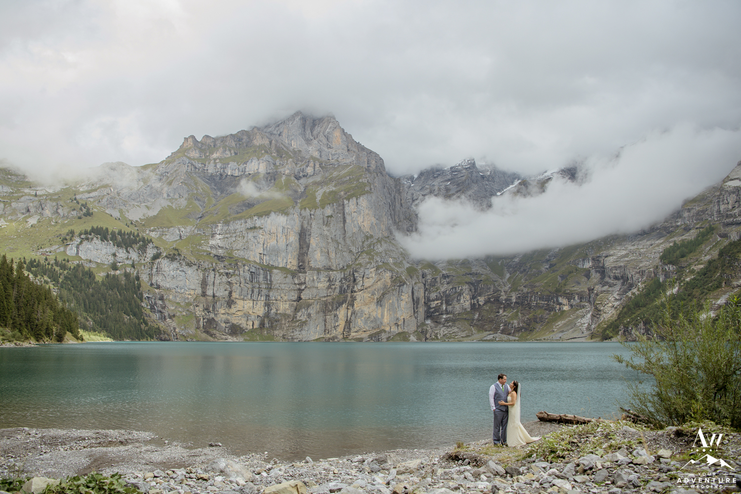 couple at oeschinensee lake in Switzerland on wedding day