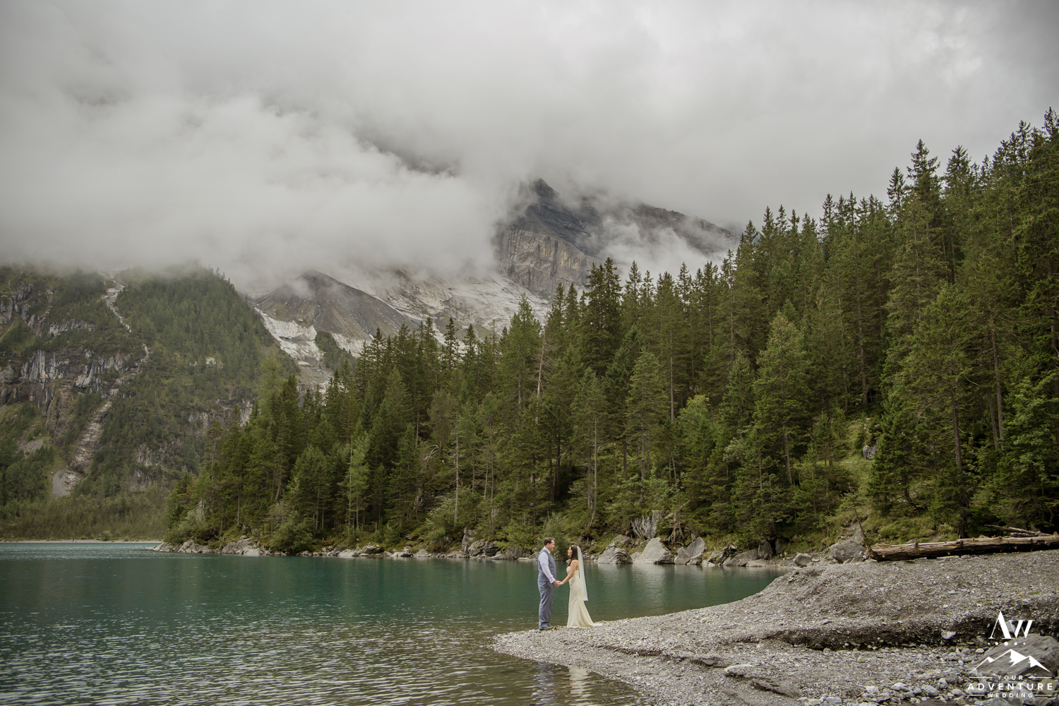 Switzerland Elopement Couple holding hands on oeschinensee lake