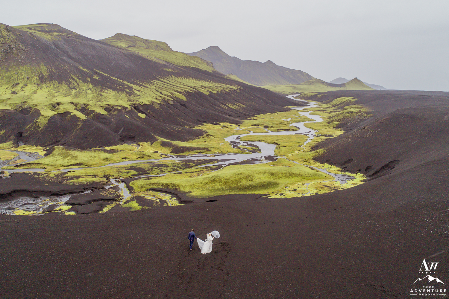 How to Plan an Adventurous Elopement-Couple Running during Iceland Adventure Wedding in the Highlands