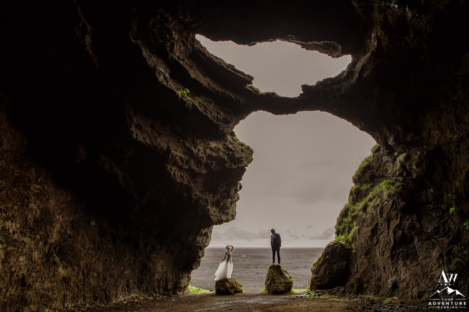Couple inside of a cave during Iceland wedding day adventure