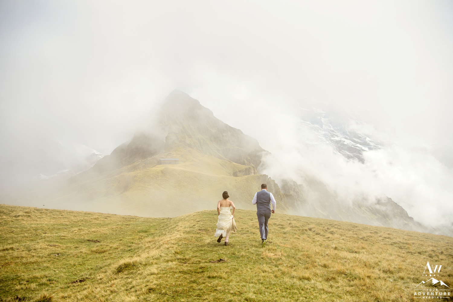 Switzerland Elopement Couple running towards Jungfrau mountain