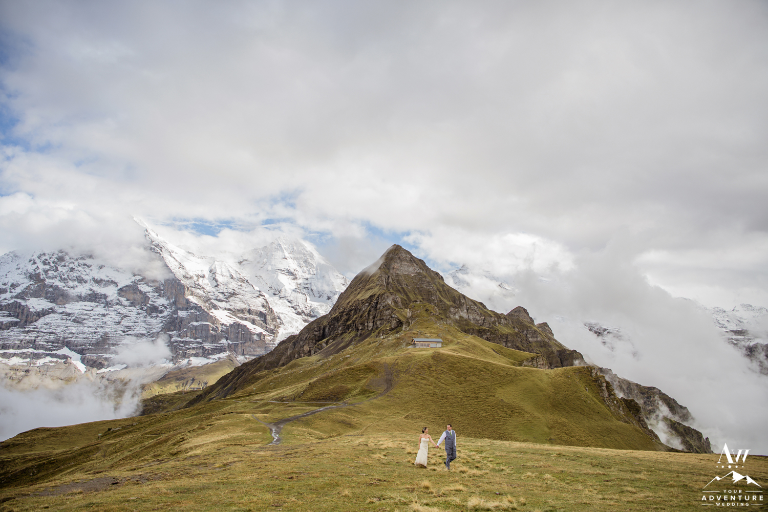 Switzerland Wedding Couple Walking with Mönch Mountain Behind