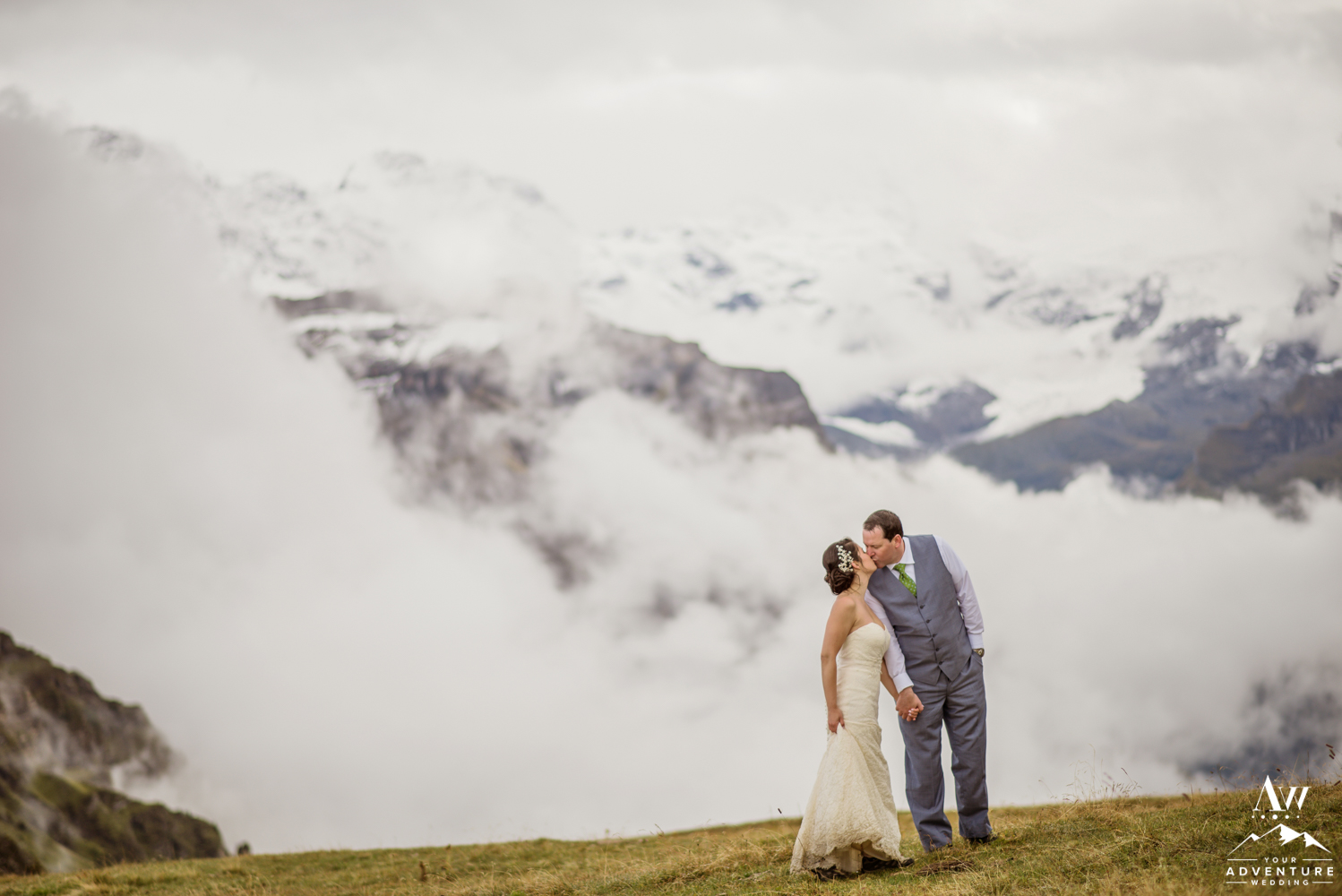 Couple kissing at the Männlichen Summit during Switzerland Elopement