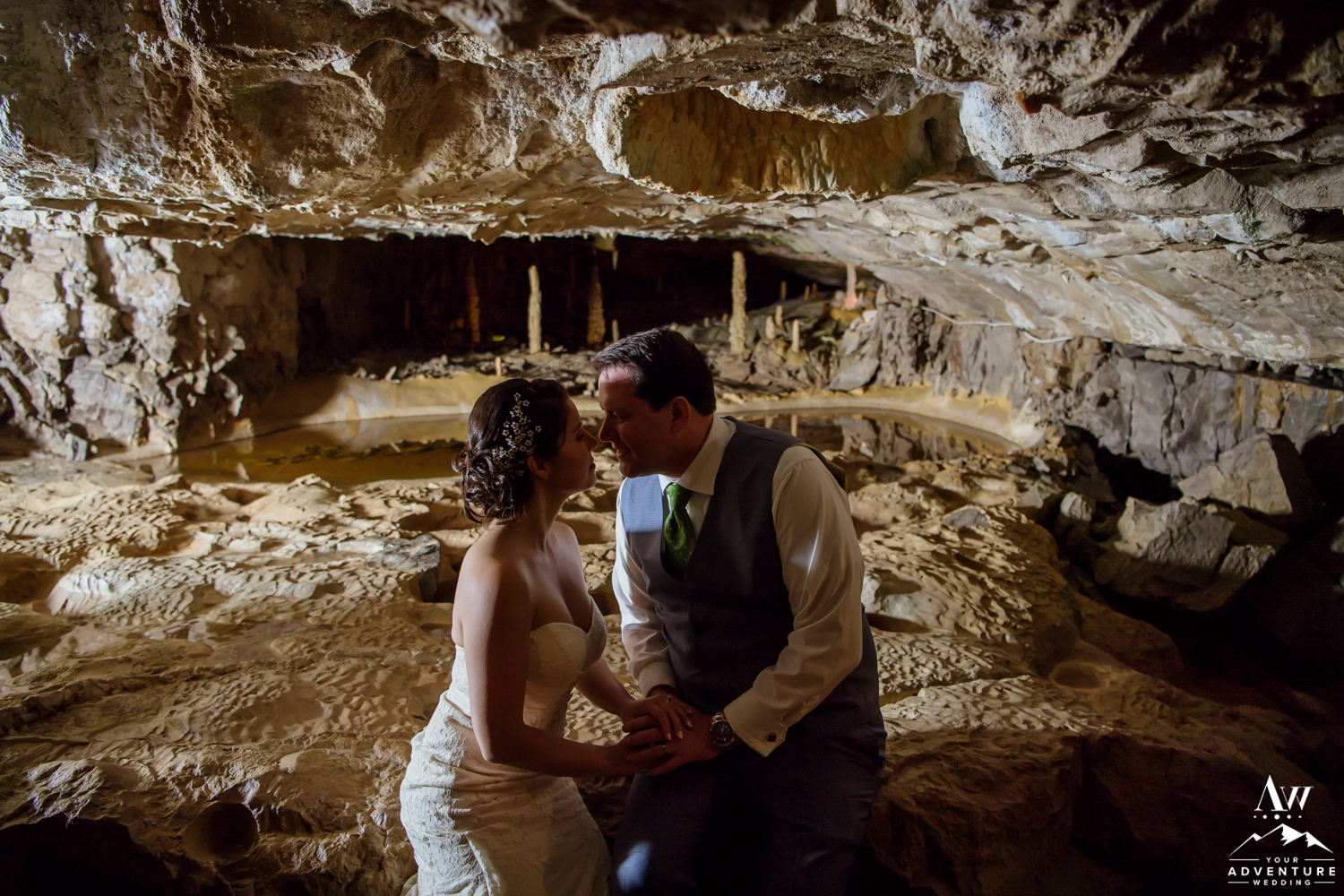 Couple Kissing in front of st beatus caves switzerland