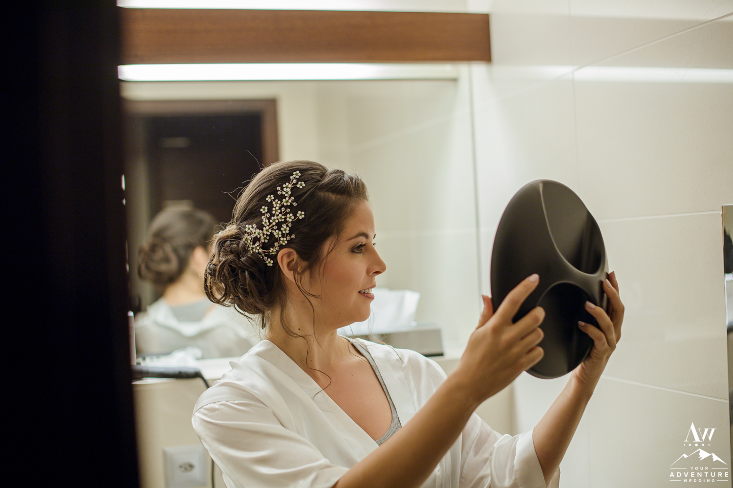 Switzerland Bride checking her hair for wedding