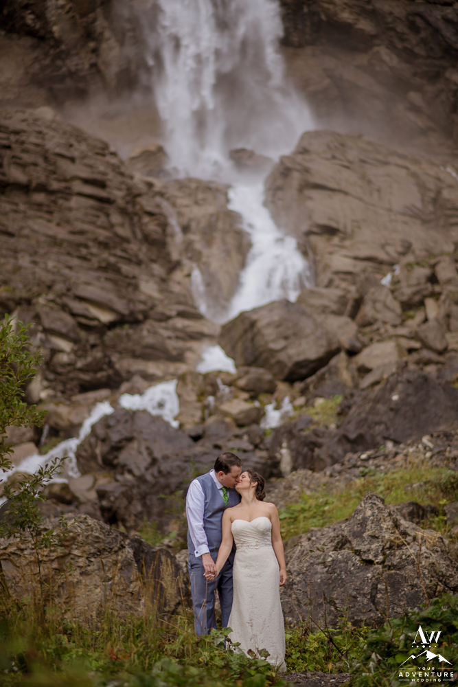 Switzerland Elopement Couple Kissing at Engstligenalp Waterfall