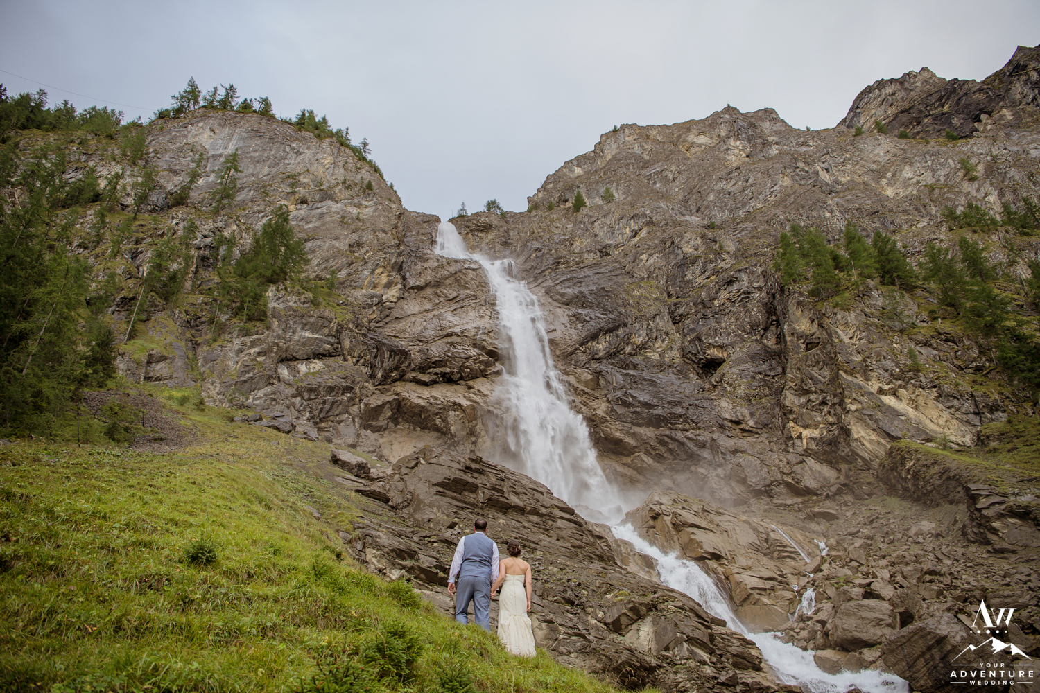 Switzerland Elopement Couple looking at Engstligenalp Waterfall