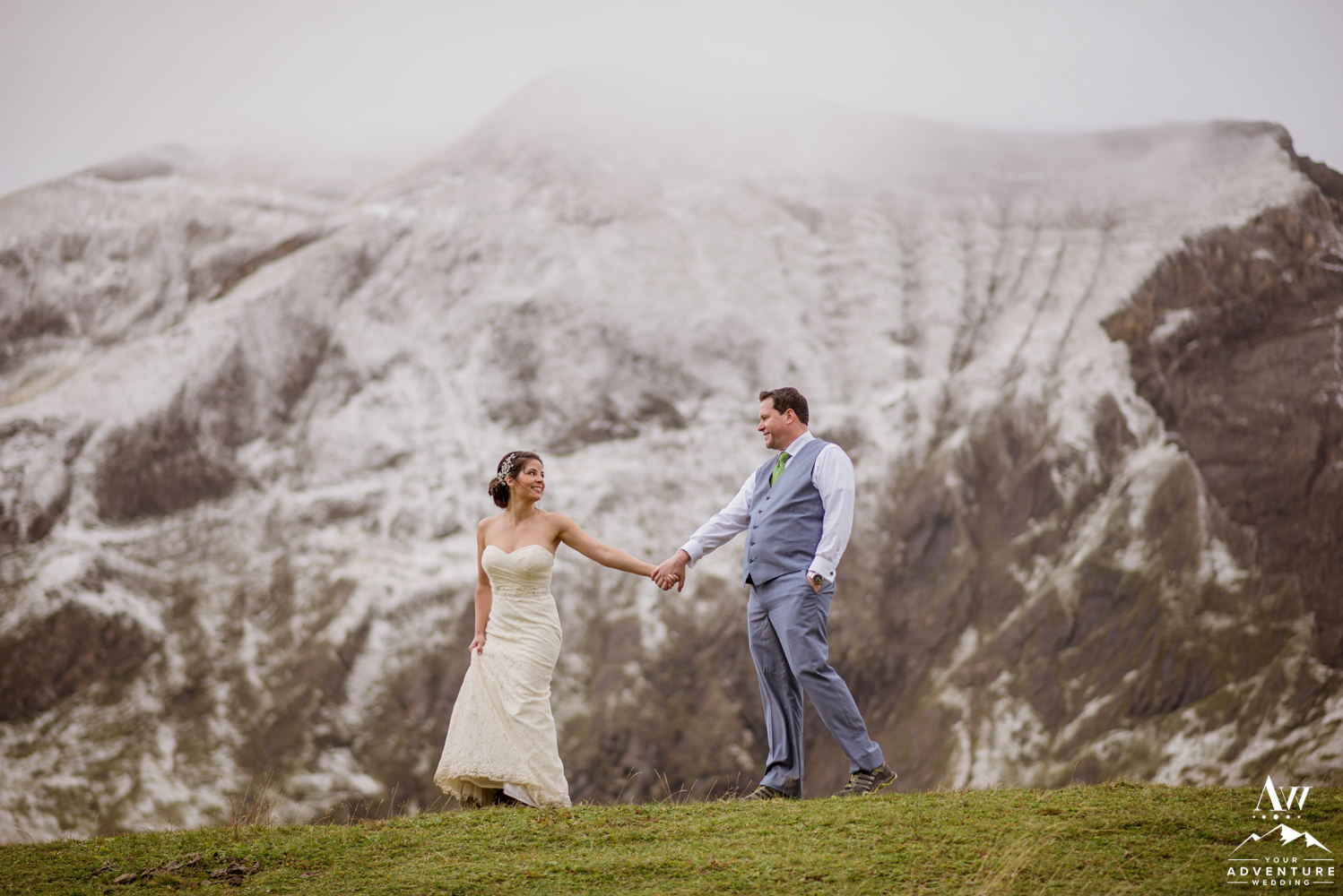 Adventurous Couple Walking on engstligenalp mountain during elopement