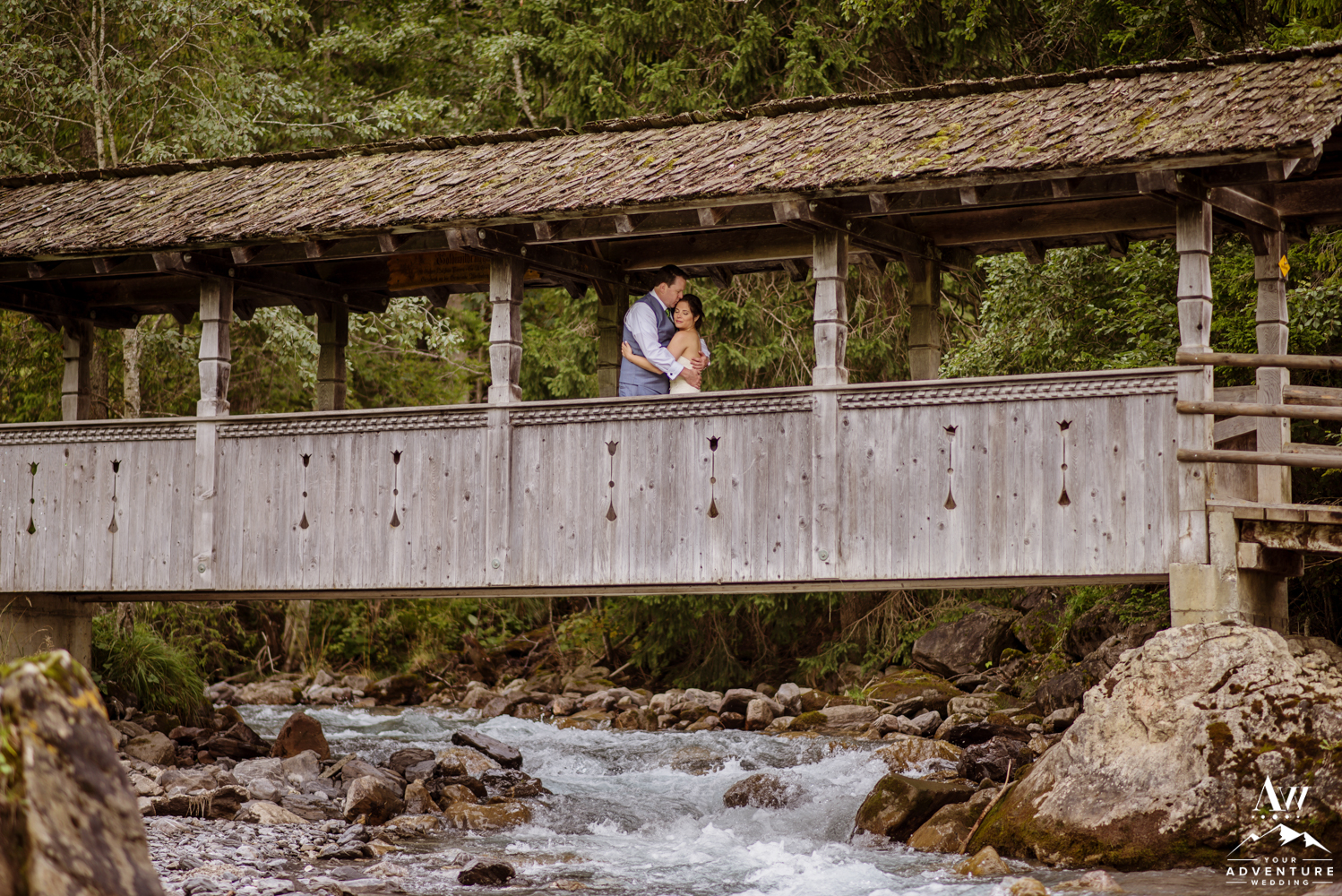 Wedding Couple at the covered bridge in Adelboden Switzerland