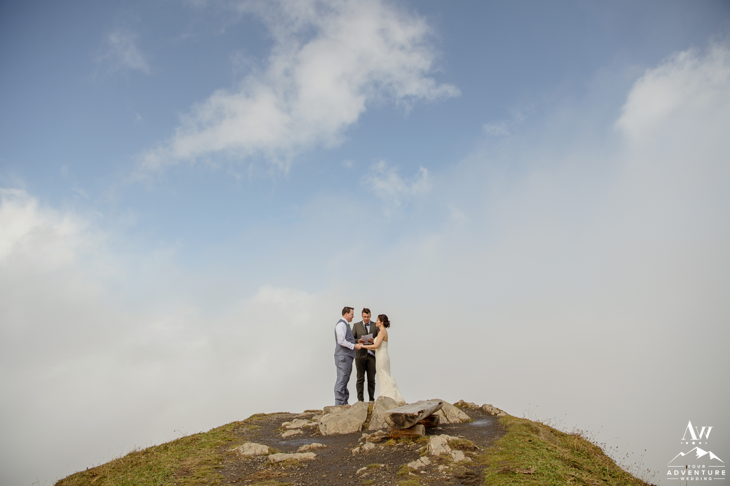 Couple getting married in the clouds on top of the Männlichen Summit