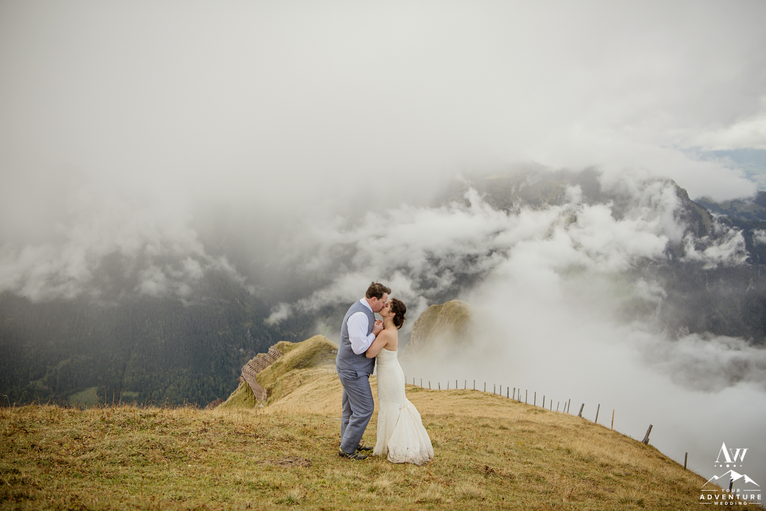 Couple kissing on top of the Männlichen Summit during Switzerland elopement