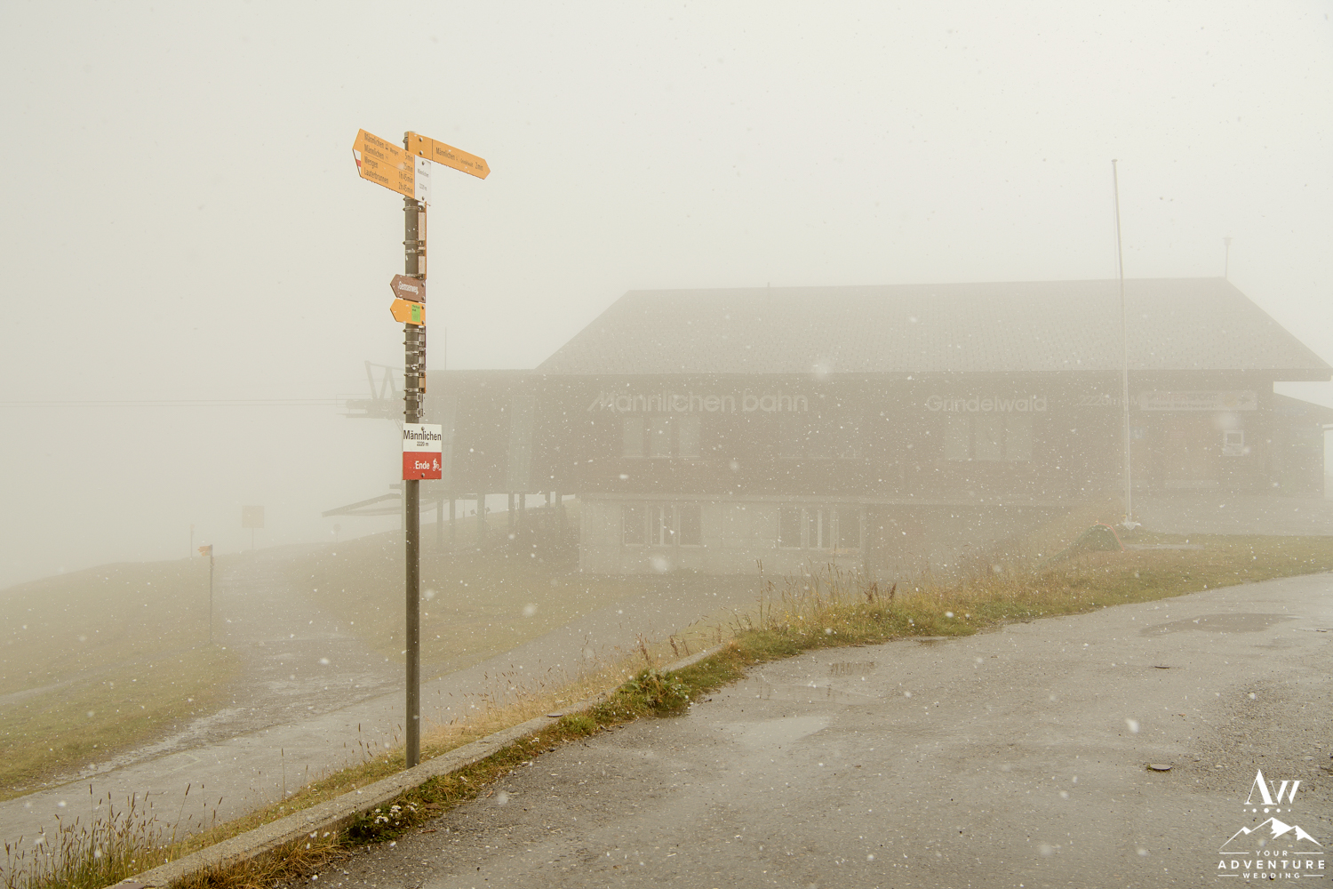 Männlichen Summit Sign Snowstorm during September