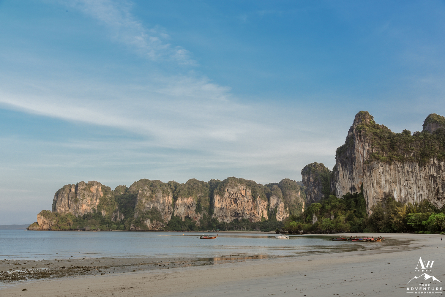 Railay Beach at sunrise mountains and golden sand