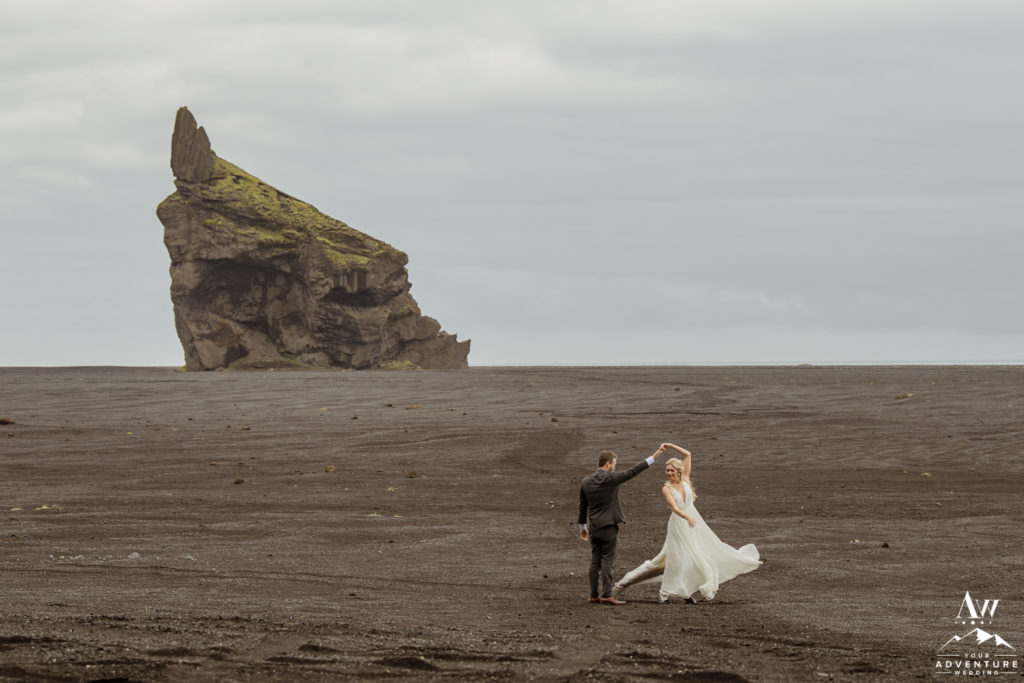 Iceland wedding couple dancing on a black desert