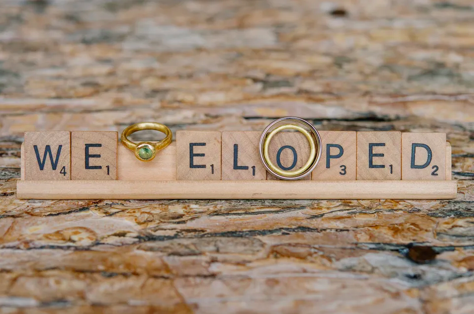 Scrabble pieces that spell out "We Eloped"