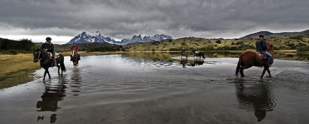 People horseback riding in Chile