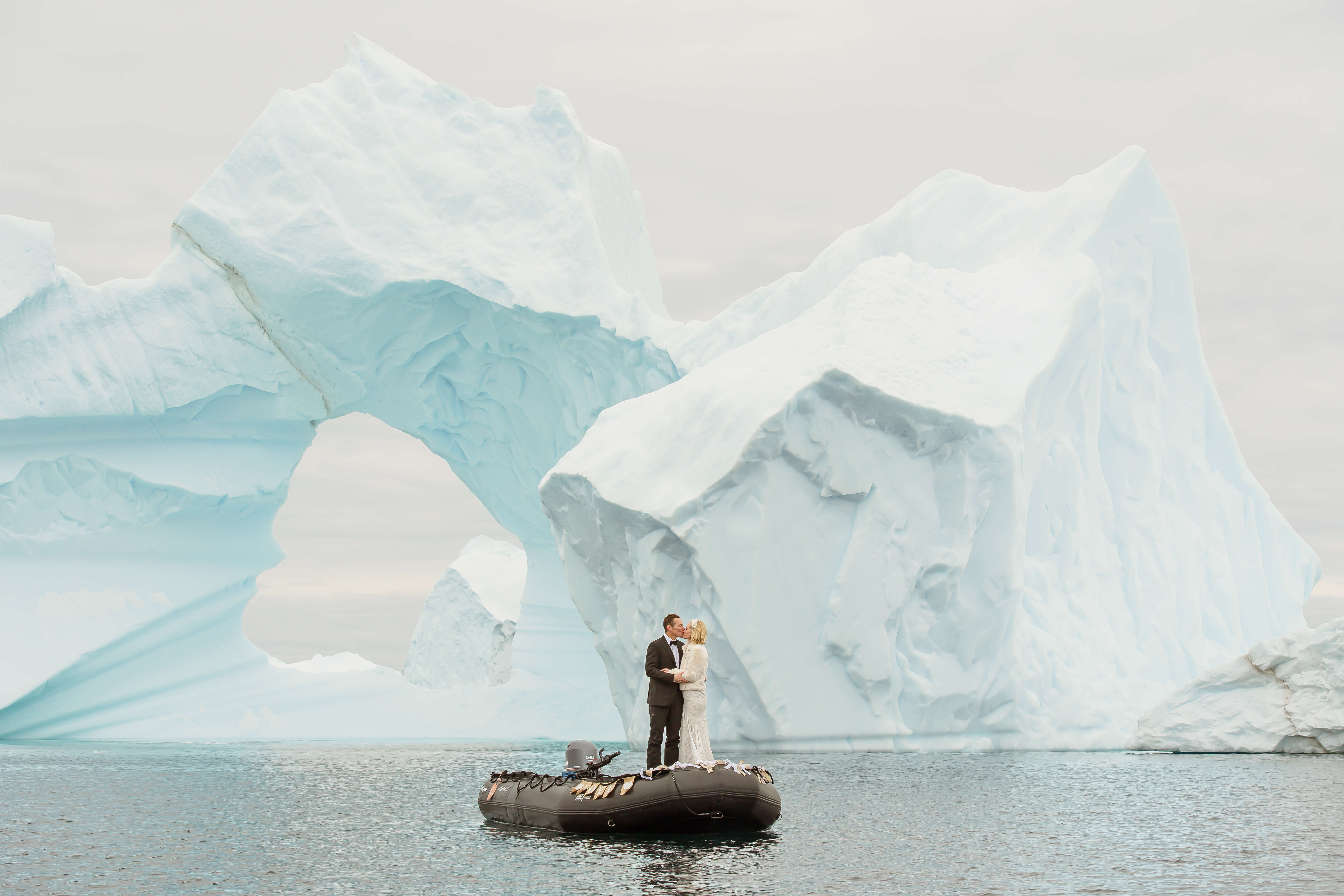 Antarctica Wedding Couple in front of Icebergs on a Boat